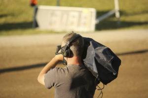 he cameraman in dust shoots a sport report